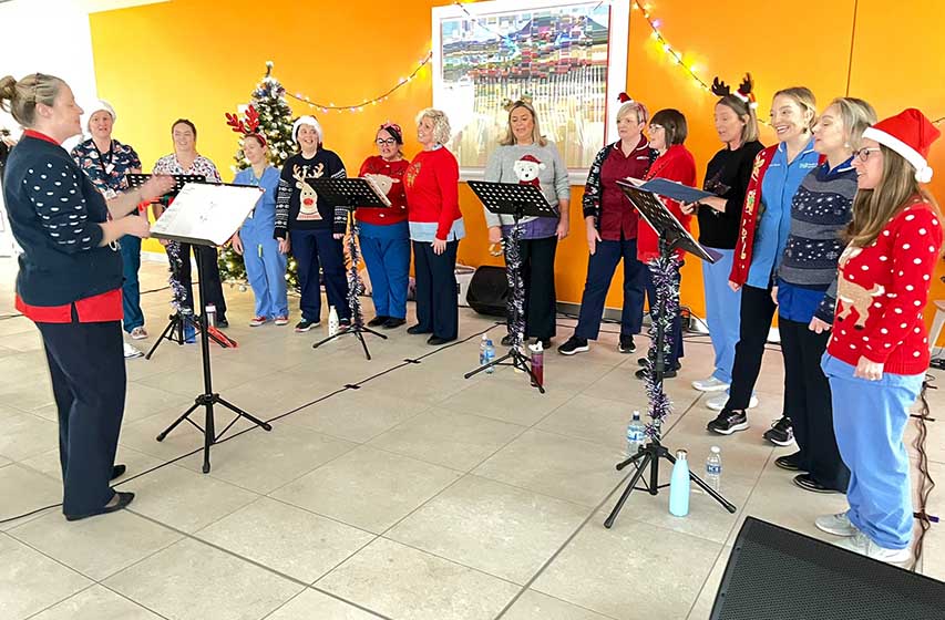 Members of the Harmony in Health Choir performing at the Christmas Carol Service in the Ulster Hospital