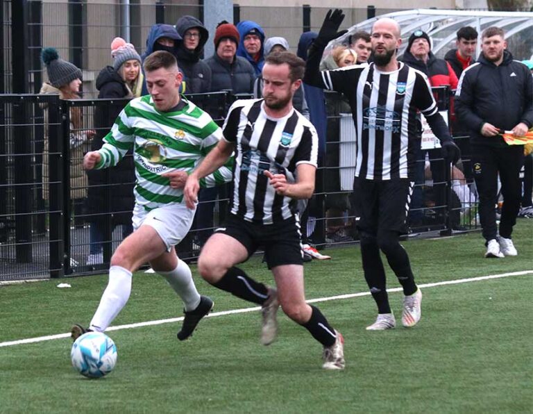 Celtic Bhoy's midfielder Millar on the ball as Newcastle Swifts Young moves in to tackle. (Photos by Cyril McKinney.)