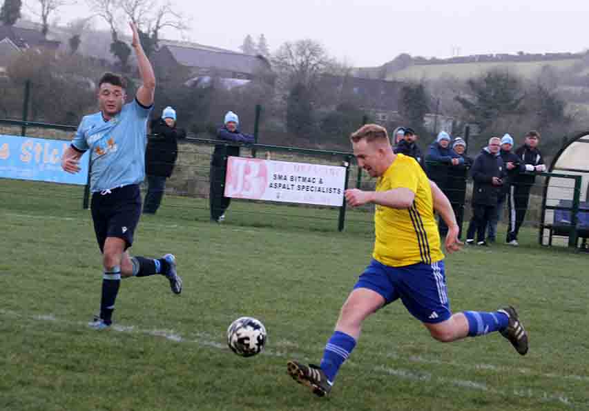 Peter Brannigan hammers home a goal fro Drumaness Mills from the back of the Ards Rangers box.