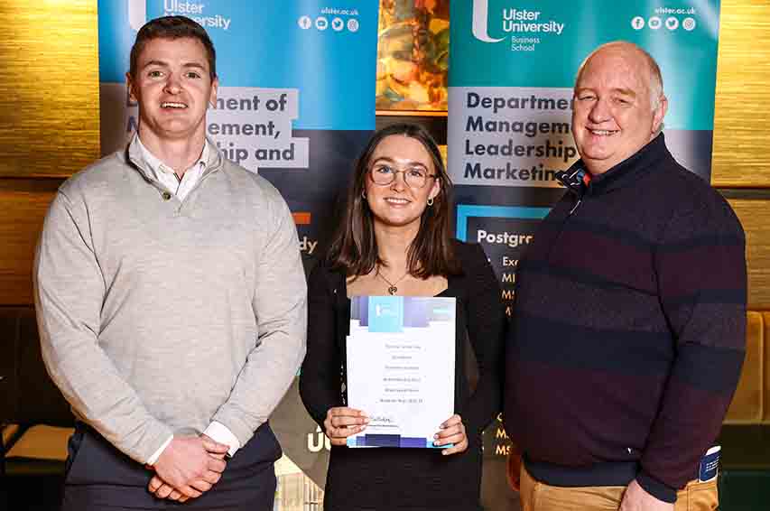 xa0Ulster University prize winner Erin Mason (centre) from Downpatrick pictured with Samuel McCormick (left) from award sponsor Grant Thornton and Course Director Paul Dickson.