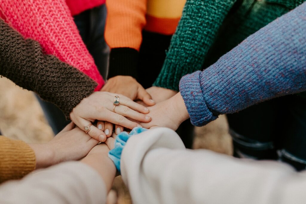 touching hands in a circle